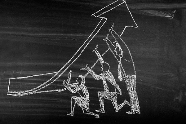 chalk drawing of three people lifting an arrow