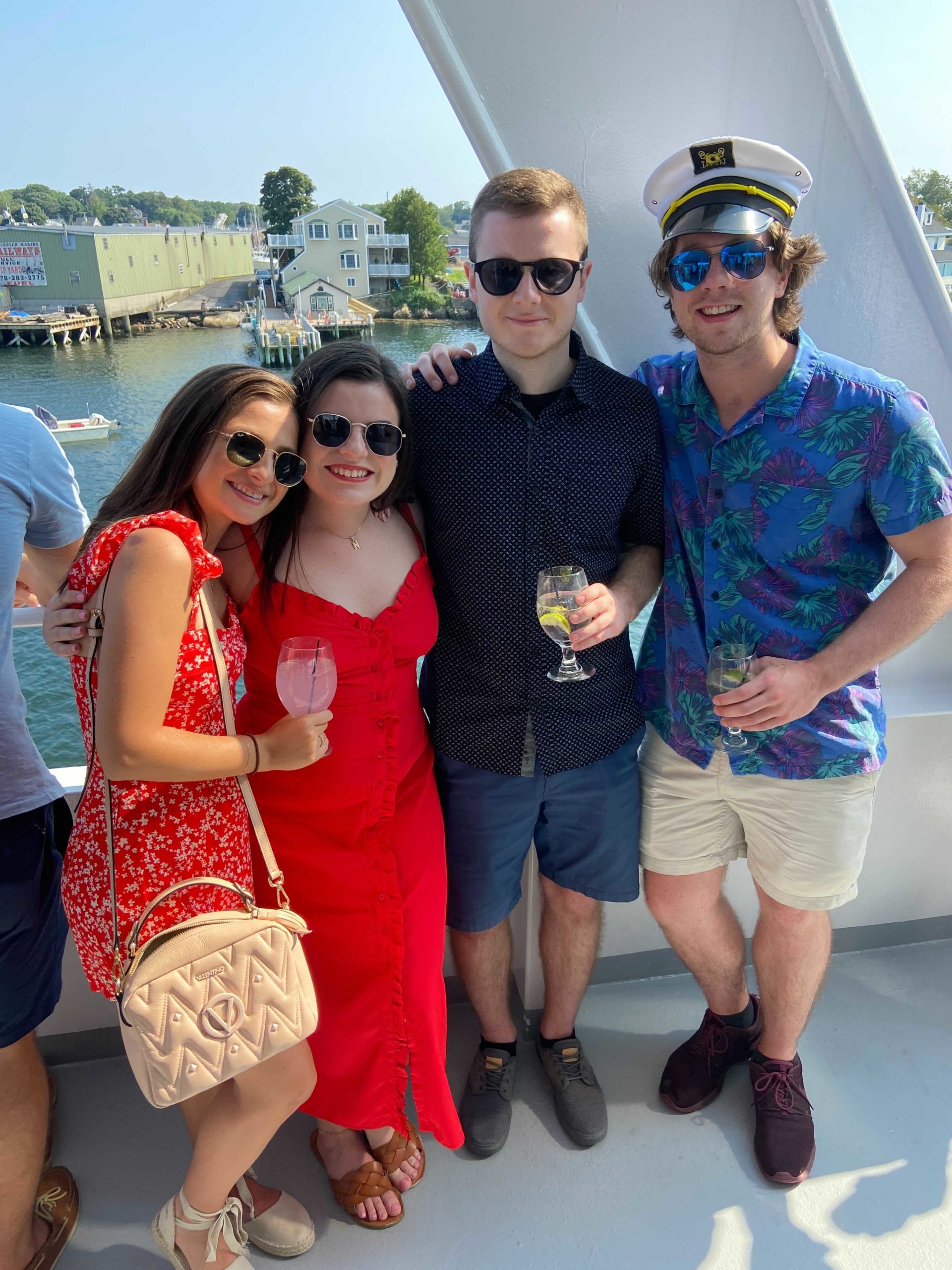 group of Reveneer employees on a boat holding drinks