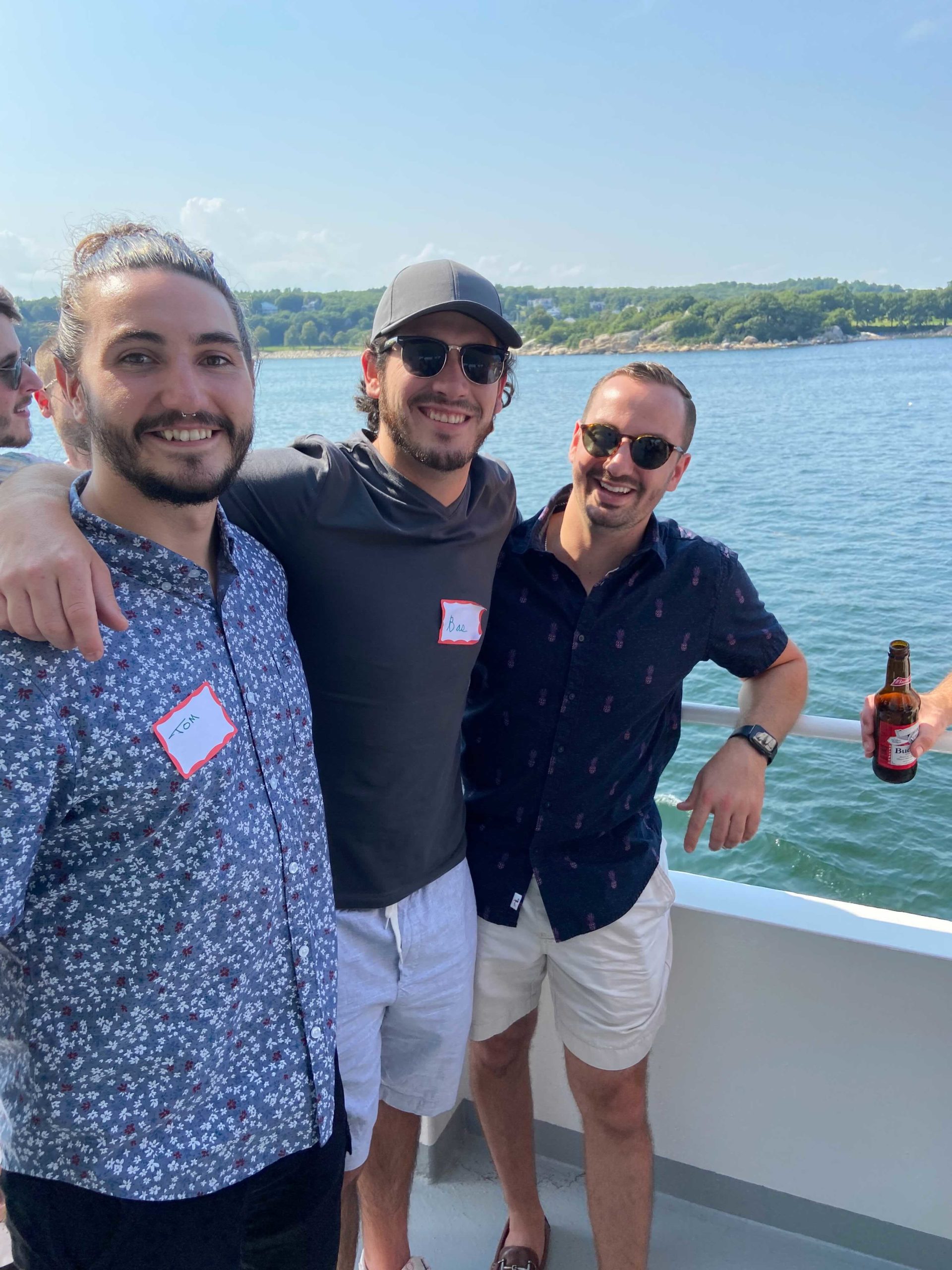 three Reveneer employees on a boat