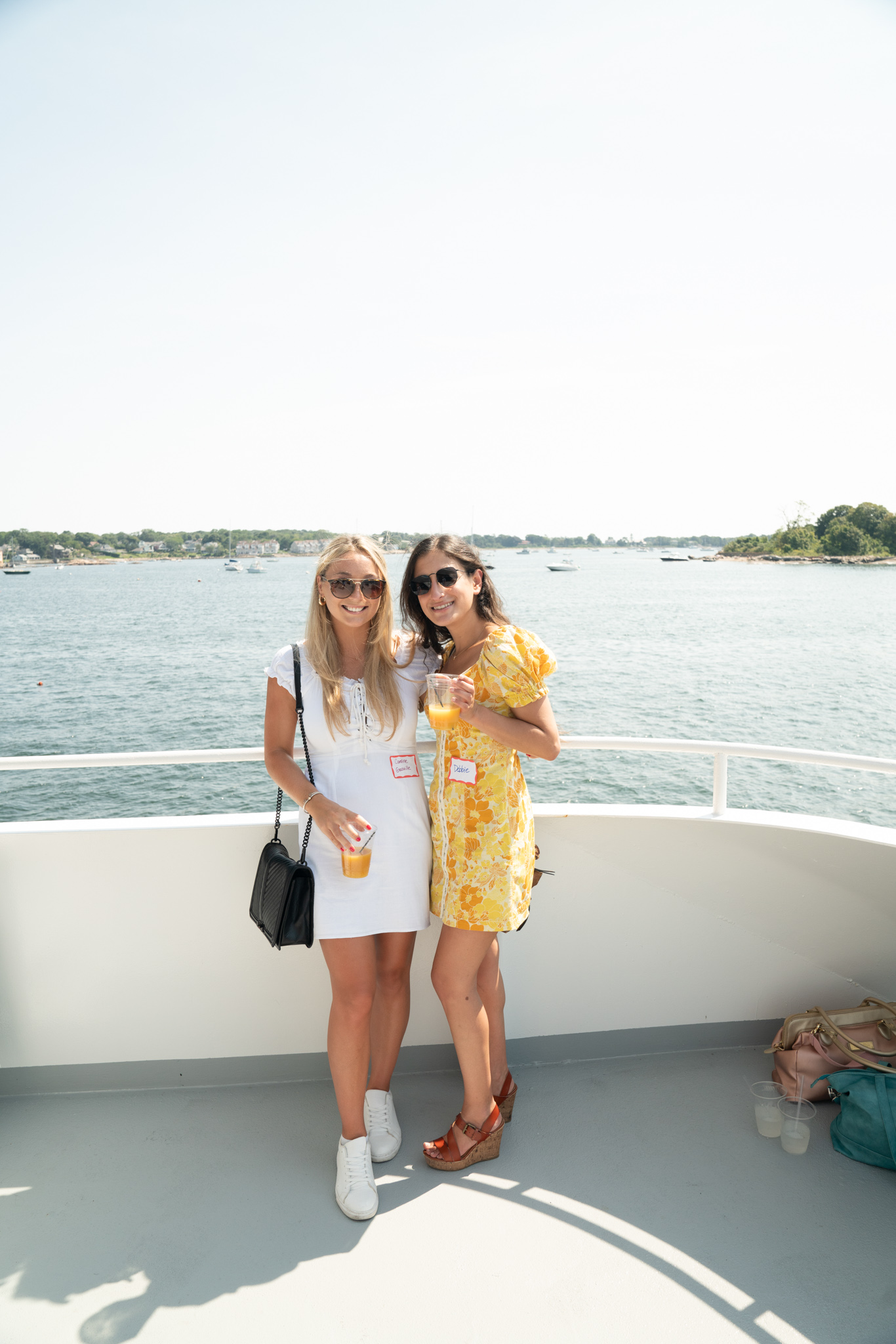 two female Reveneer employees on a boat