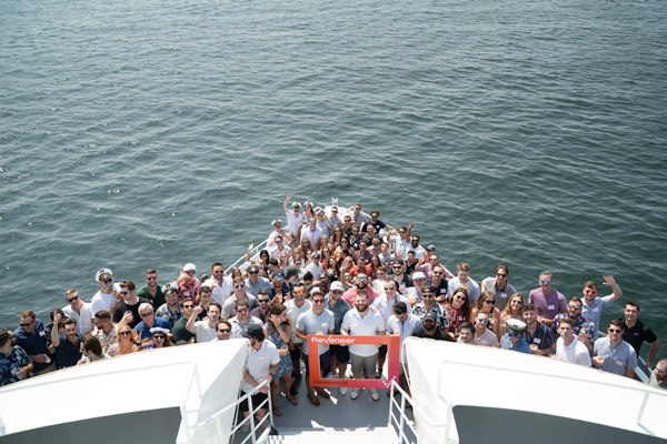 Company shot of Reveneer employees on a boat
